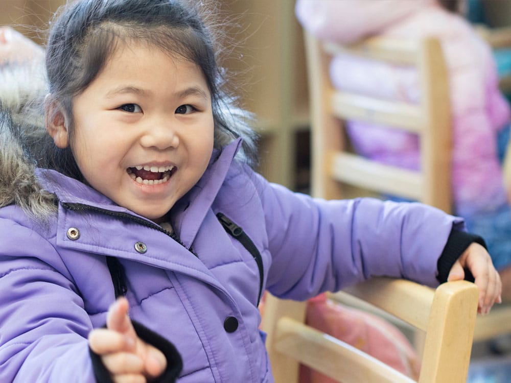 Little girl in purple coat