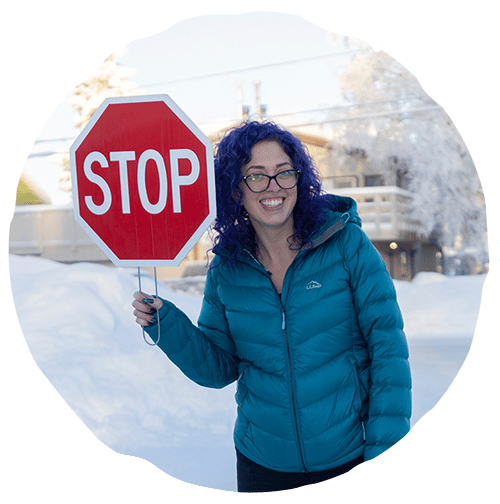 Woman holding a stop sign